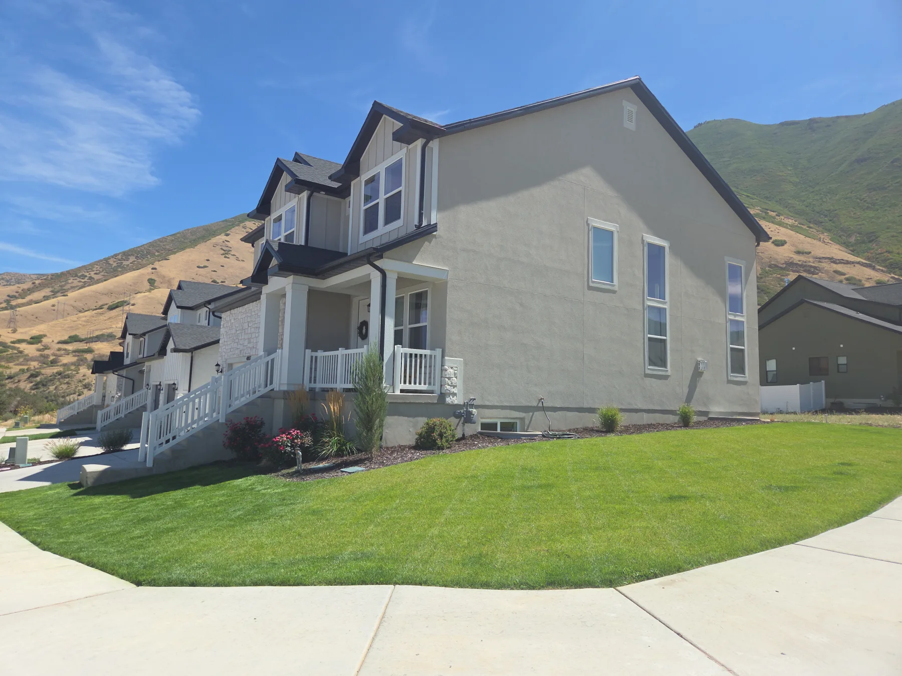Professionally maintained lawn and landscaping around a mountain home